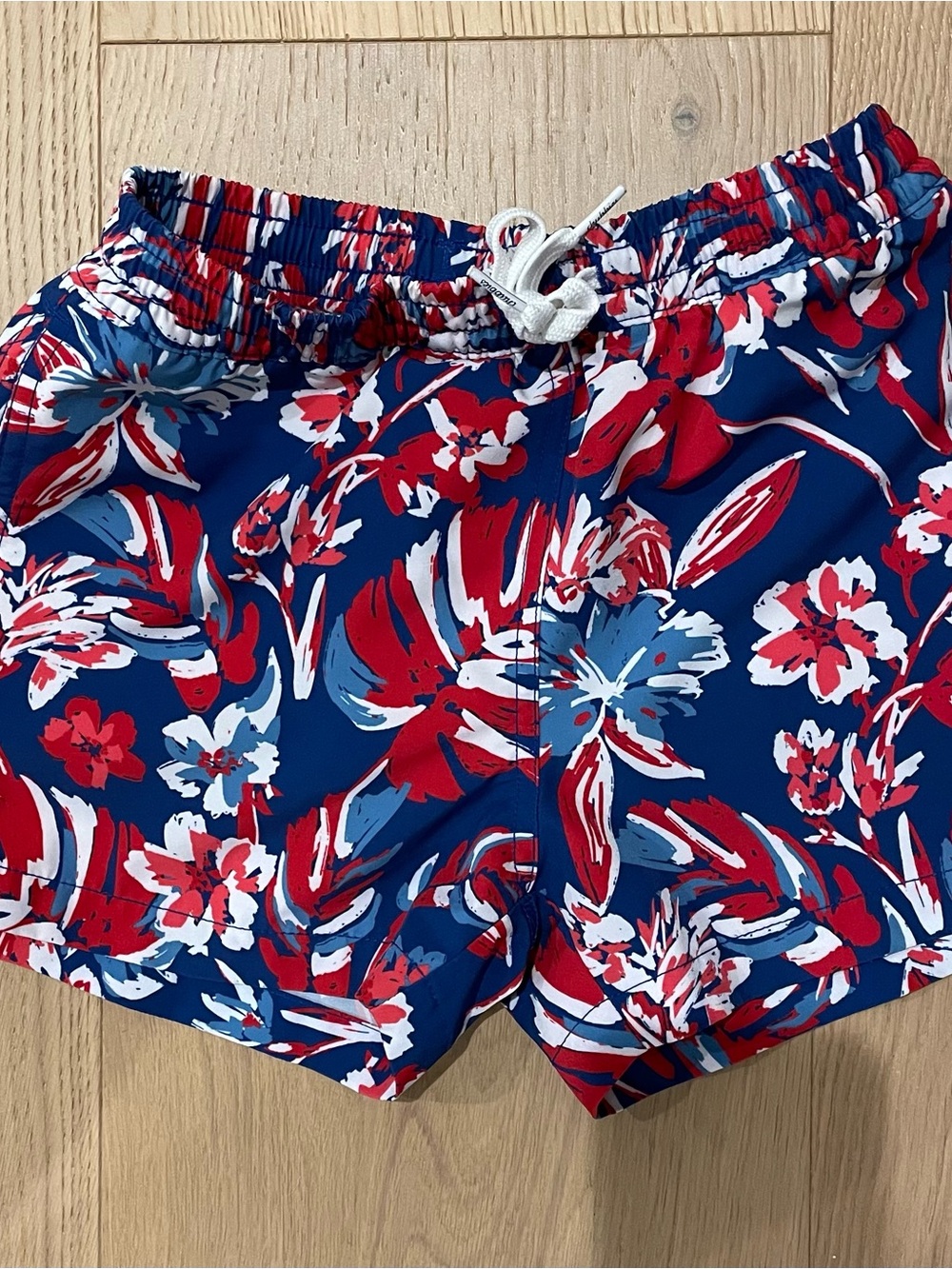 Chubbies Kids Navy Swim Trunks with Red & White Floral Print